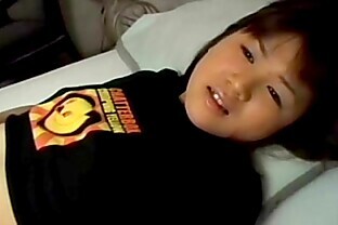 Asian Girl Laying on Back Stroking Pussy on Bed